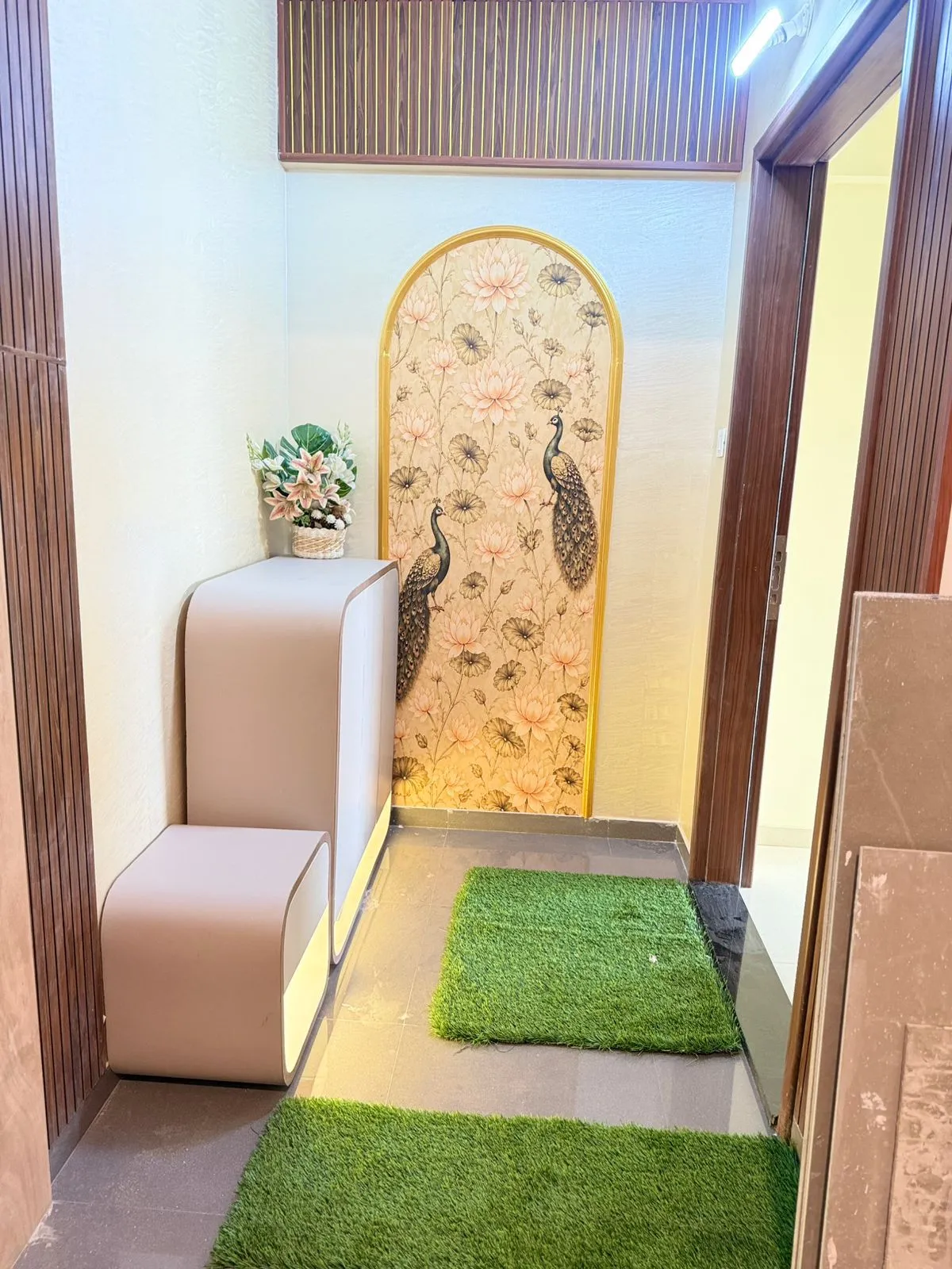 Pooja wall detailing and illuminated storage at our Wakad residence project